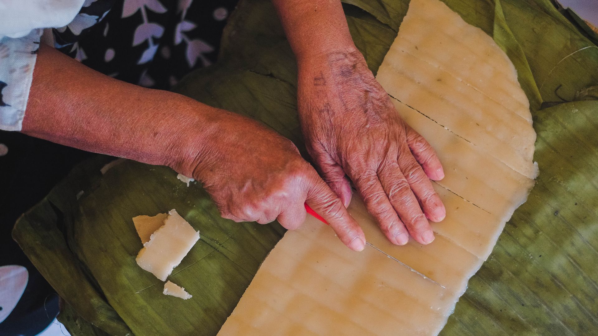 Bekelech's hands as she cuts strips of kocho for toasting