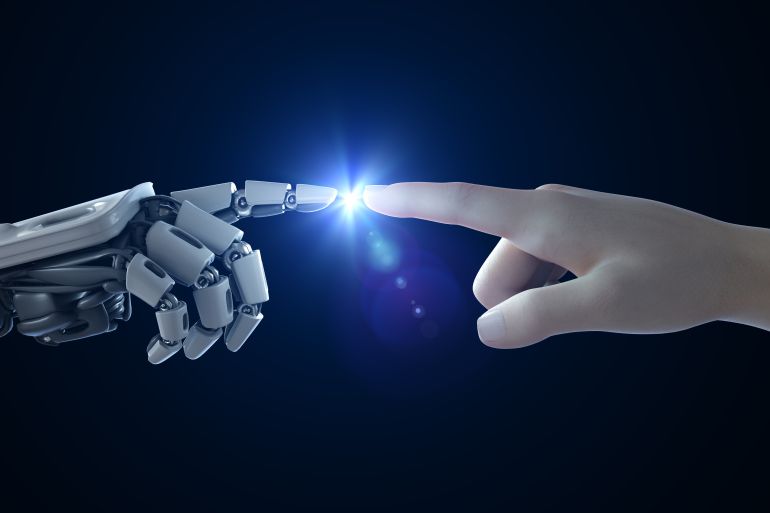 A human and robot touching the tip of their index fingers with a small blue sparkling light seemingly emanating from their contact in this computer illustration.
