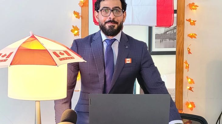 Hassan Al Kontar in front of a Canadian flag