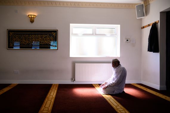 A member of mosque staff prays in the otherwise empty Noor Ul Islam Mosque on the day before Ramadan commences in the UK, in Bury, Greater Manchester on April 24, 2020.