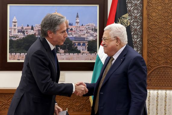 Palestinian President Mahmud Abbas (R) and US Secretary of State Antony Blinken shake hands following their meeting in Ramallah in the occupied West Bank