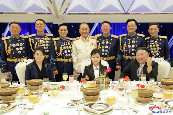 This picture taken on February 7, 2023 and released from North Korea's official KCNA on Fenruary 8, 2023 shows leader Kim Jong Un attending a banquet to mark the 75th anniversary of the Korean People's Army, with his wife Ri Sol-Ju and daughter