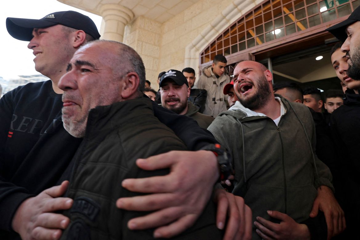 Relatives mourn the death of a Palestinian killed in an Israeli raid