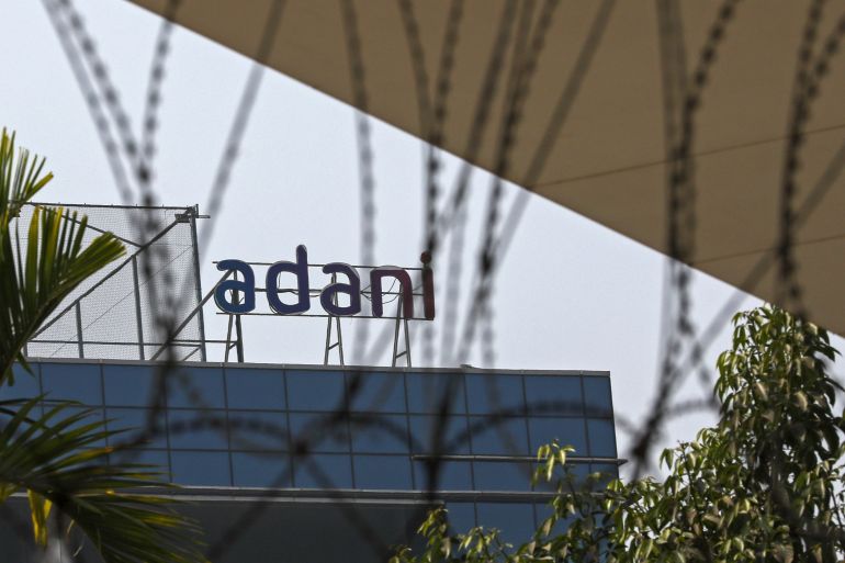 The logo of Adani Group atop a building in Mumbai, India.