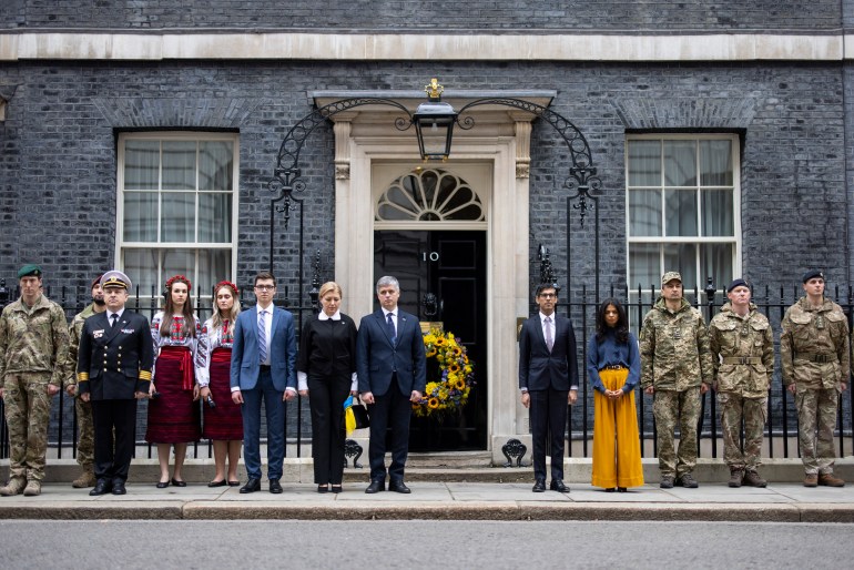British and Ukrainian officials observe a minute of silence outside 10 Downing Street in London