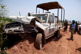 One of the United Nations-African Union Mission in Darfur (UNAMID) vehicles that was ambushed by unidentified assailants is seen at El Geneina, October 3, 2012. Four Nigerian peacekeepers were killed and eight wounded in an ambush in Sudan's western Darfur region, the international peacekeeper force UNAMID said on Wednesday. "They were killed last night some 2 km (1.2 miles) from our regional headquarters in El Geneina. They came under fire from all sides," a spokesman for UNAMID said. Picture taken October 3, 2012. REUTERS/United Nations-African Union Mission in Darfur/Albert Gonzalez Farran/Handout (SUDAN - Tags: CIVIL UNREST MILITARY POLITICS TRANSPORT) FOR EDITORIAL USE ONLY. NOT FOR SALE FOR MARKETING OR ADVERTISING CAMPAIGNS. THIS IMAGE HAS BEEN SUPPLIED BY A THIRD PARTY. IT IS DISTRIBUTED, EXACTLY AS RECEIVED BY REUTERS, AS A SERVICE TO CLIENTS