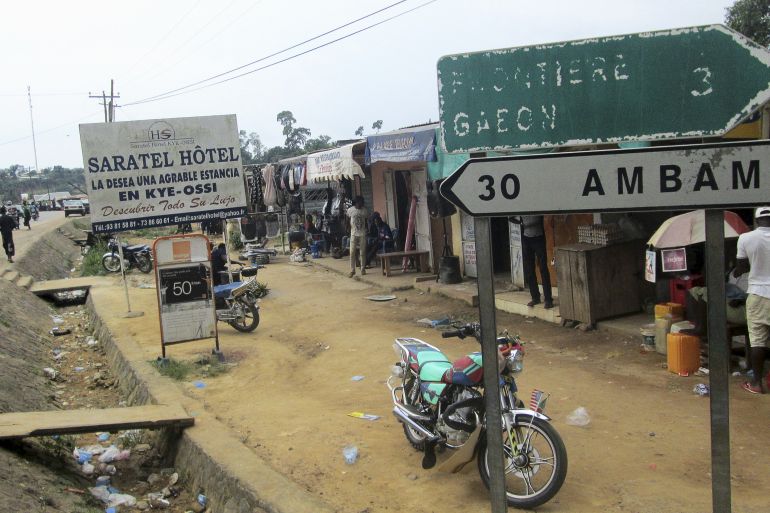 Signs are seen at the border with Equatorial Guinea and Gabon in Kye-Ossi, Cameroo