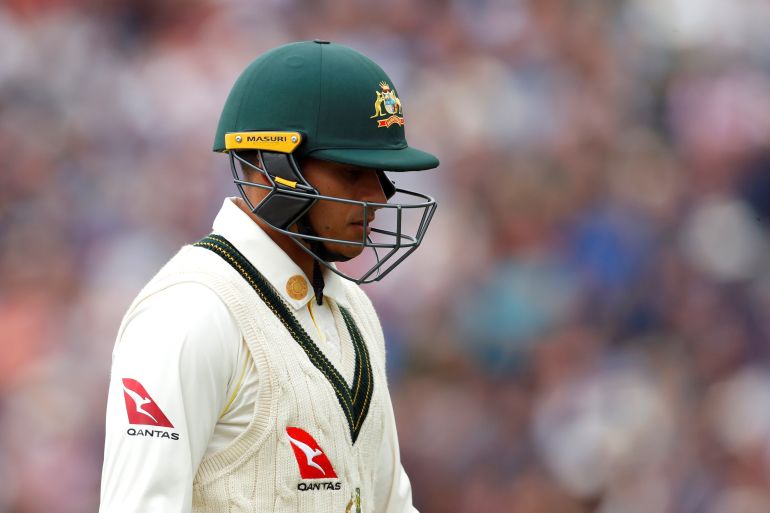 Australia's Usman Khawaja reacts after losing his wicket