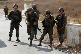 Israeli forces gather during a Palestinian protest demanding Israel to reopen closed roads leading to Nablus.