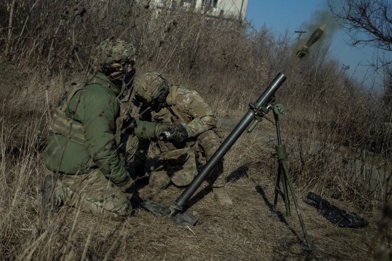 Ukrainian servicemen fire a mortar on a front line, as Russia's attack on Ukraine continues, in Bakhmut, Donetsk region, Ukraine January 27, 2023
