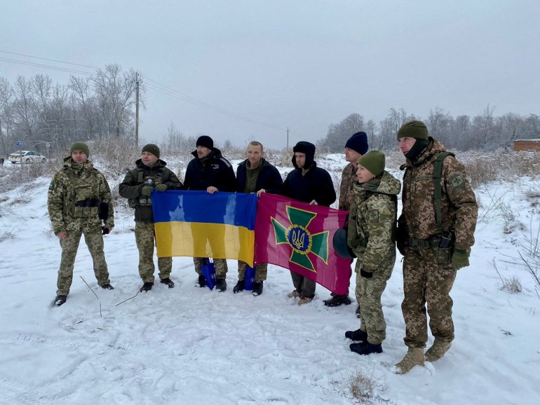 Ukrainian prisoners of war (POWs) pose for a picture after a swap, amid Russia's attack on Ukraine, in an unknown location, Ukraine, in this handout picture released February 4, 2023. Press Service of the General Staff of the Ukrainian Armed Forces/Handout via REUTERS ATTENTION EDITORS - THIS IMAGE HAS BEEN SUPPLIED BY A THIRD PARTY. REFILE - CORRECTING YEAR