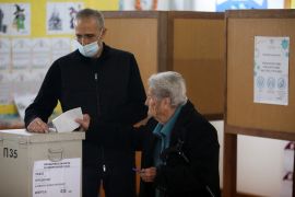 A person casts a ballot for the presidential election at a polling station in Geroskipou near Paphos, Cyprus, February 5, 2023