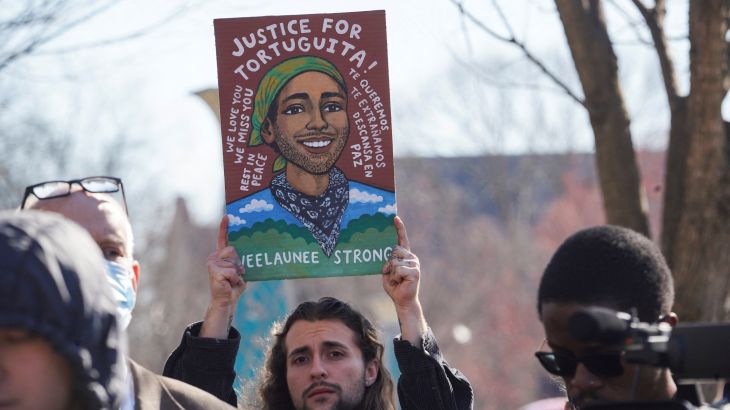 An Atlanta activist holds a sign demanding justice for environmental activist Manuel Teran, killed by police in Atlanta, US