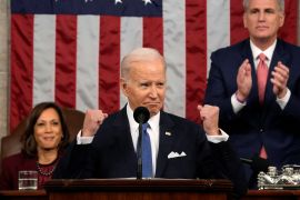US President Joe Biden, with Vice President Kamala Harris and House Speaker Kevin McCarthy behind him, delivers the State of the Union address to a joint session of Congress at the US Capitol.
