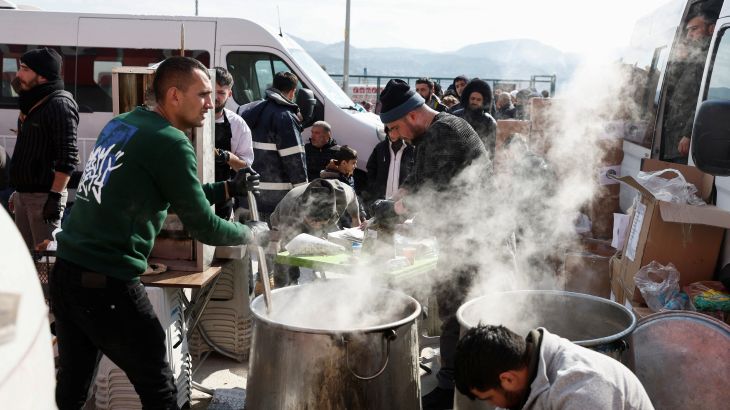 Volunteers prepare shorba for the internally displaced people at the Yeni Hatay Stadyumu camp, Turkey.