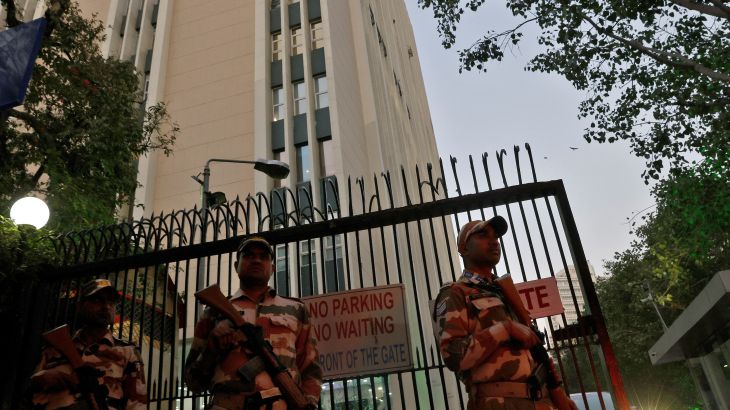 Members of the Indo-Tibetan Border Police (ITBP) stand guard outside a building housing BBC offices, where income tax officials are conducting a search for a second day, in New Delhi, India, February 15, 2023. REUTERS/Altaf Hussain