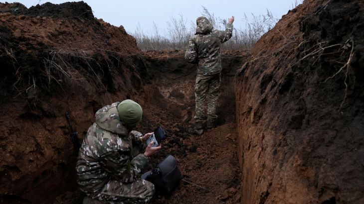 FILE PHOTO: Two soldiers with the 58th Independent Motorized Infantry Brigade of the Ukrainian Army who wanted to be identified as "Ghost", 24, and "Soap", 30, release their drone for a test flight, as Russia's invasion of Ukraine continues, near Bakhmut, Ukraine, November 25, 2022. REUTERS/Leah Millis SEARCH " UKRAINE-CRISIS/ANNIVERSARY-TIMELINE" FOR ALL IMAGES/File Photo