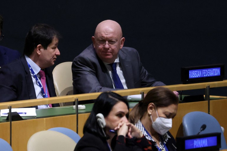 Russia's Ambassador to the United Nations Vasily Nebenzya after the vote on the resolution. He is listening to a colleague and looks glum.