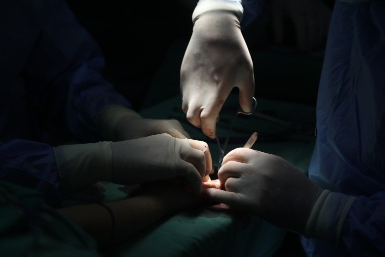 Hands of surgeons operating