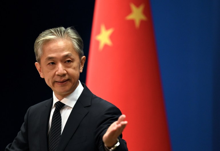 Chinese Foreign Ministry spokesman Wang Wenbin gestures during a press conference at the Ministry of Foreign Affairs in Beijing on August 8, 2022. (Photo by Noel Celis / AFP)