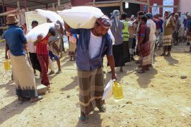 Displaced Yemenis receive WFP aid in Yemen&#039;s northern province of Hajjah [File: Essa Ahmed/AFP]