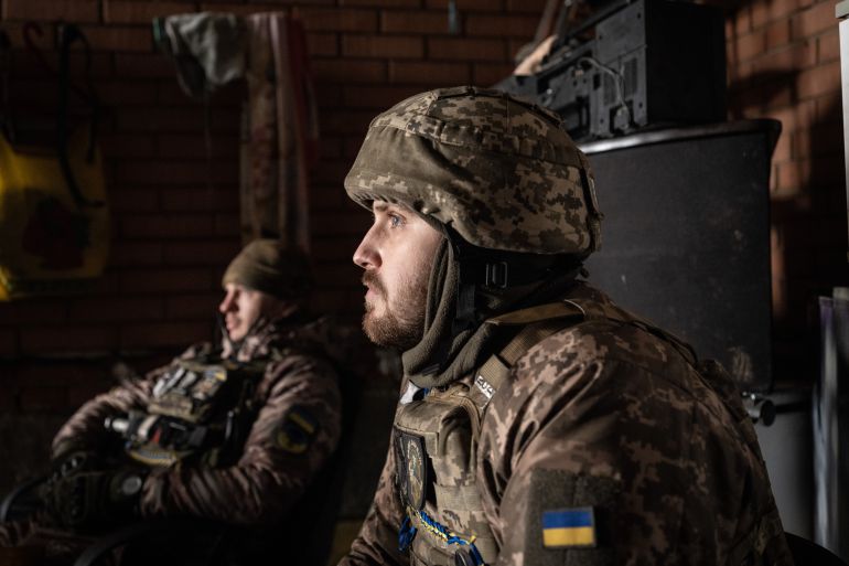 Ukrainian servicemen of the 93rd brigade await a fire-mission orde