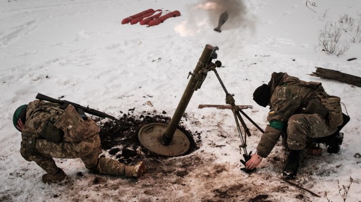 Ukrainian serviceman fire a mortar toward a Russian position in Bakhmut, Ukraine, on February 16, 2023 [Yasuyoshi Chiba/ AFP]