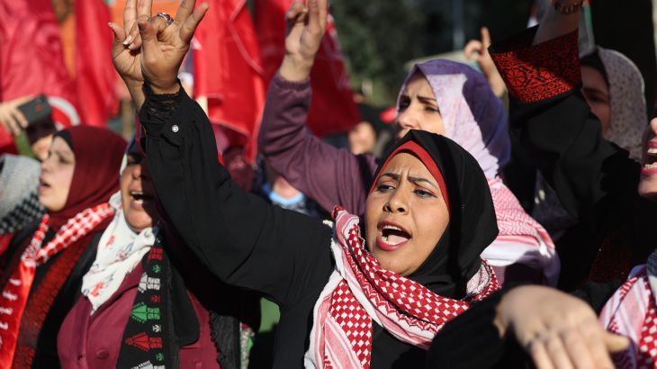 Palestinians take part in a march to denounce the Israeli military's deadly raid in Nablus