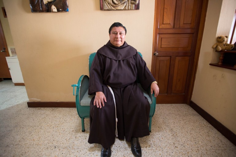 Friar German Tax sits in a chair in the entrance of the migrant shelter in Colonia Mezquital on February 14