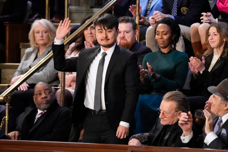 Brandon Tsay waves when introduced by Joe Biden during the State of Union address.