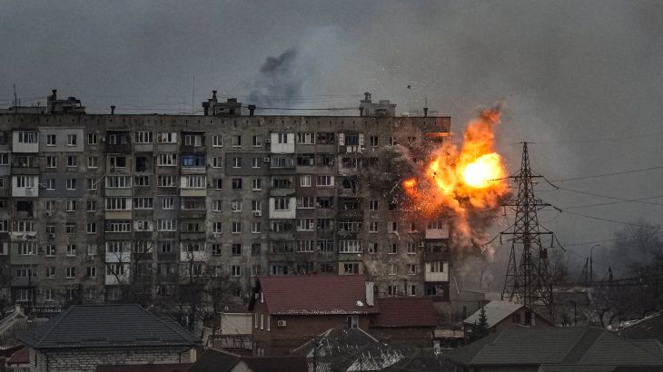 An explosion erupts from an apartment building at 110 Mytropolytska St., after a Russian army tank fired on it in Mariupol