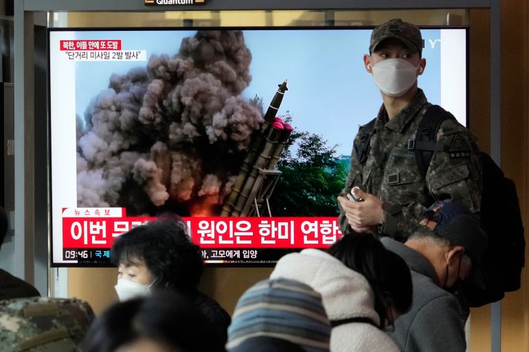 A TV screen shows a file image of North Korea's missile launch during a news program at the Seoul Railway Station in Seoul, South Korea, Monday, Feb. 20, 2023