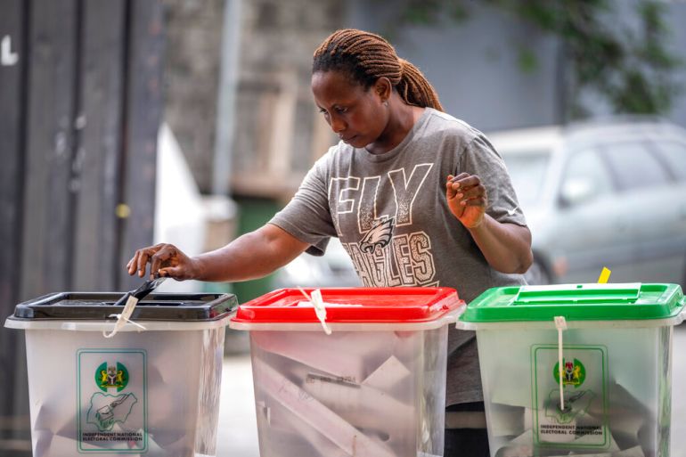 A woman casts her vote at a polling station in Lagos, Nigeria