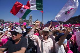 Antigovernment demonstrators shout slogans against Mexican President Andres Manuel Lopez Obrador, during a march against recent reforms to the country's electoral law that they say threaten democracy, in Mexico City's main square, The Zocalo.