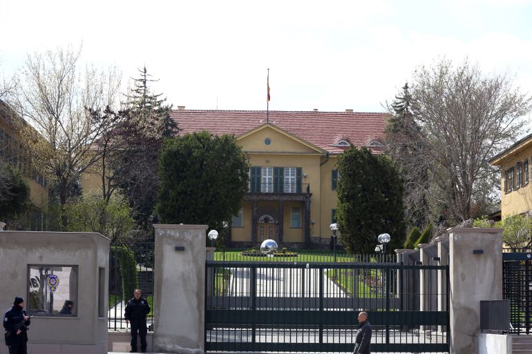 Turkish security officials stand at the entrance of German embassy in Ankara