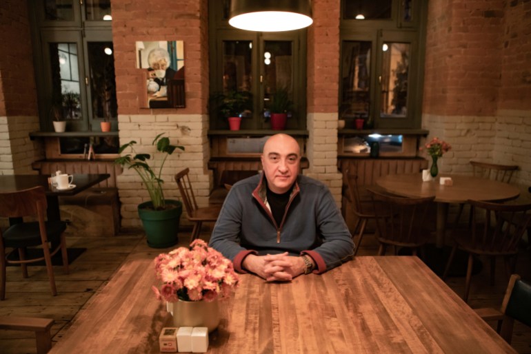 A photo of Levan Pesvianidze sitting at a table.