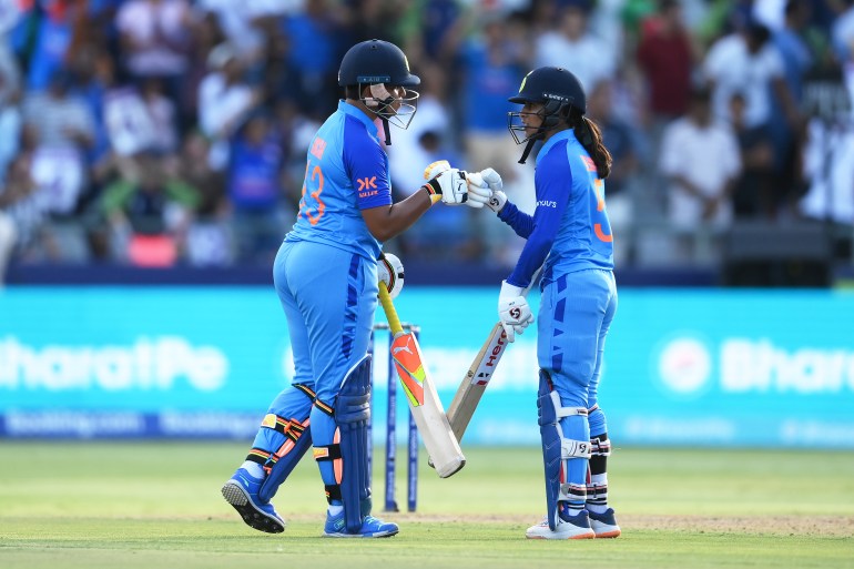 Richa Ghosh and Jemimah Rodrigues of India interact during the ICC Women's T20 World Cup group B match between India and Pakistan