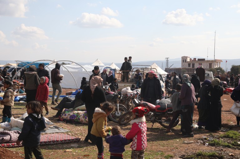 Syrians out in the open trying to make shelters after the earthquake
