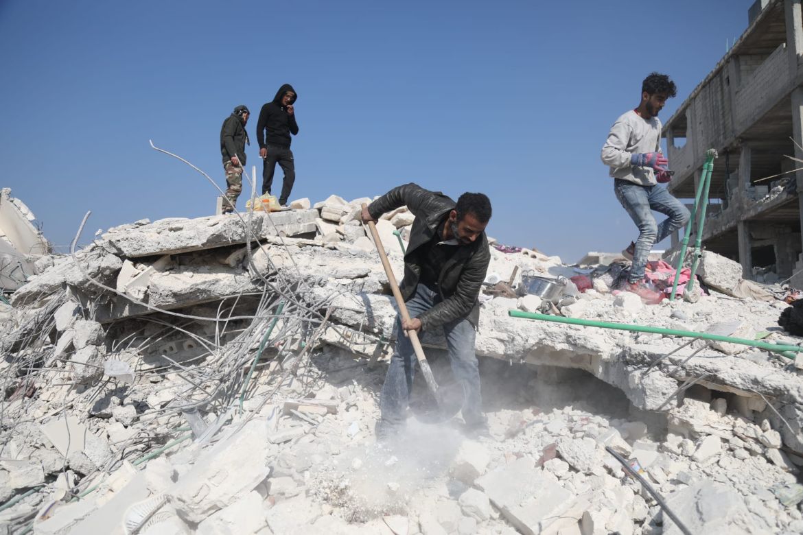 Mohammad Ghazi Sbeih, an IDP from from Kafr Sijna, digs through the rubble of his home in Jandaris.