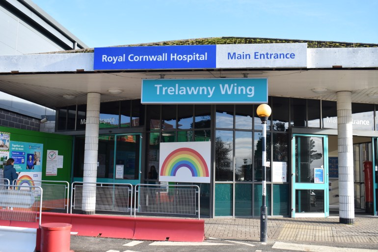 A photo of a building with a sign above that says "Trelawny Wing".