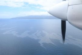 This Philippine Coast Guard image shows an aerial view of an oil spill in waters off Naujan, Oriental Mindoro province, Philippines