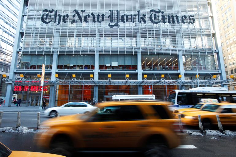 FILE PHOTO: Vehicles drive past the New York Times headquarters in New York March 1, 2010. REUTERS/Lucas Jackson/File Photo