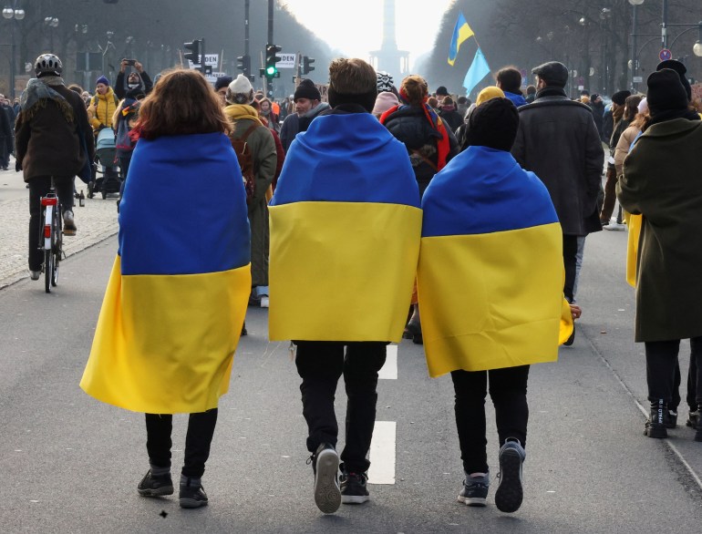 People draped in Ukrainan flags