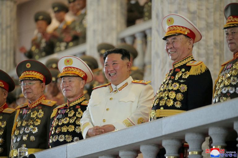 North Korean leader Kim Jong Un watches a nighttime military parade to mark the 90th anniversary of the founding of the Korean People's Revolutionary Army in Pyongyang, North Korea, in this undated photo released by North Korea's Korean Central News Agency (KCNA) on April 26, 2022. KCNA via REUTERS  ATTENTION EDITORS - THIS IMAGE WAS PROVIDED BY A THIRD PARTY. REUTERS IS UNABLE TO INDEPENDENTLY VERIFY THIS IMAGE. NO THIRD PARTY SALES. SOUTH KOREA OUT. NO COMMERCIAL OR EDITORIAL SALES IN SOUTH KOREA. TPX IMAGES OF THE DAY