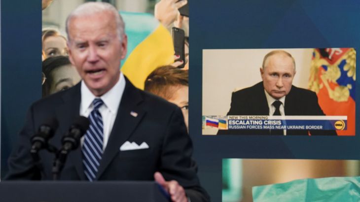 Russia's President Vladimir Putin is seen on a display in the background as U.S. President Joe Biden speaks about "gas prices and Putin's Price Hike" during remarks in the Eisenhower Executive Office Building's South Court Auditorium at the White House in Washington, U.S., June 22, 2022. REUTERS/Kevin Lamarque