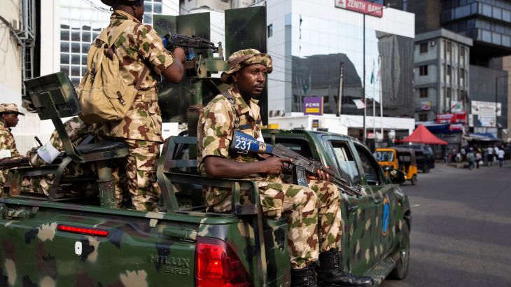 Nigerian soldiers patrol near a market to prevent election-related violence in Lagos Island, Lagos, Nigeria, February 27, 2023. REUTERS/James Oatway.