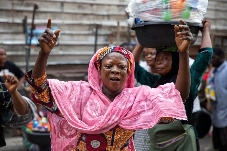 A woman dances in celebration of Bola Ahmed Tinubu's victory in an election, that has been disputed by opposition parties, in Lagos