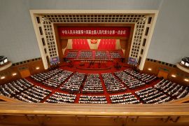 Chinese officials and delegates attend the opening session of the National People's Congress at the Great Hall of the People in Beijing, China.