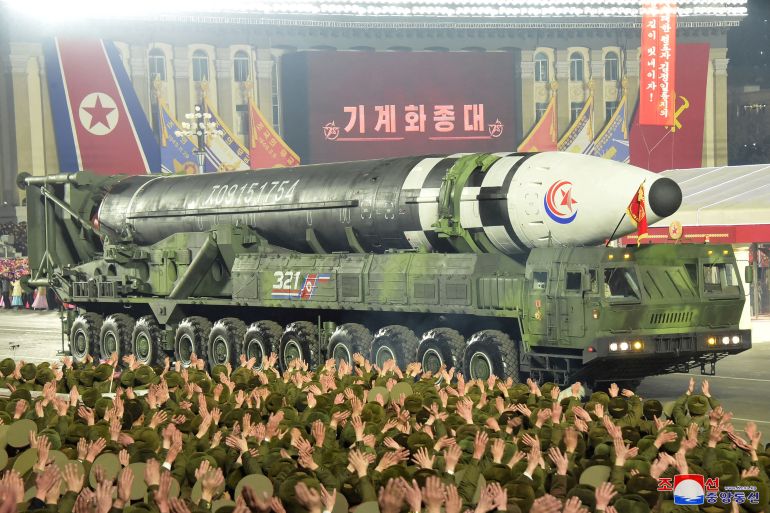 A missile is displayed with hundreds of troops watching during a military parade to mark the 75th anniversary of the founding of North Korea's army, at Kim Il Sung Square in Pyongyang, North Korea.