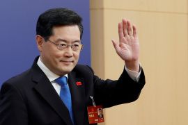 China's foreign minister Qin Gang waves